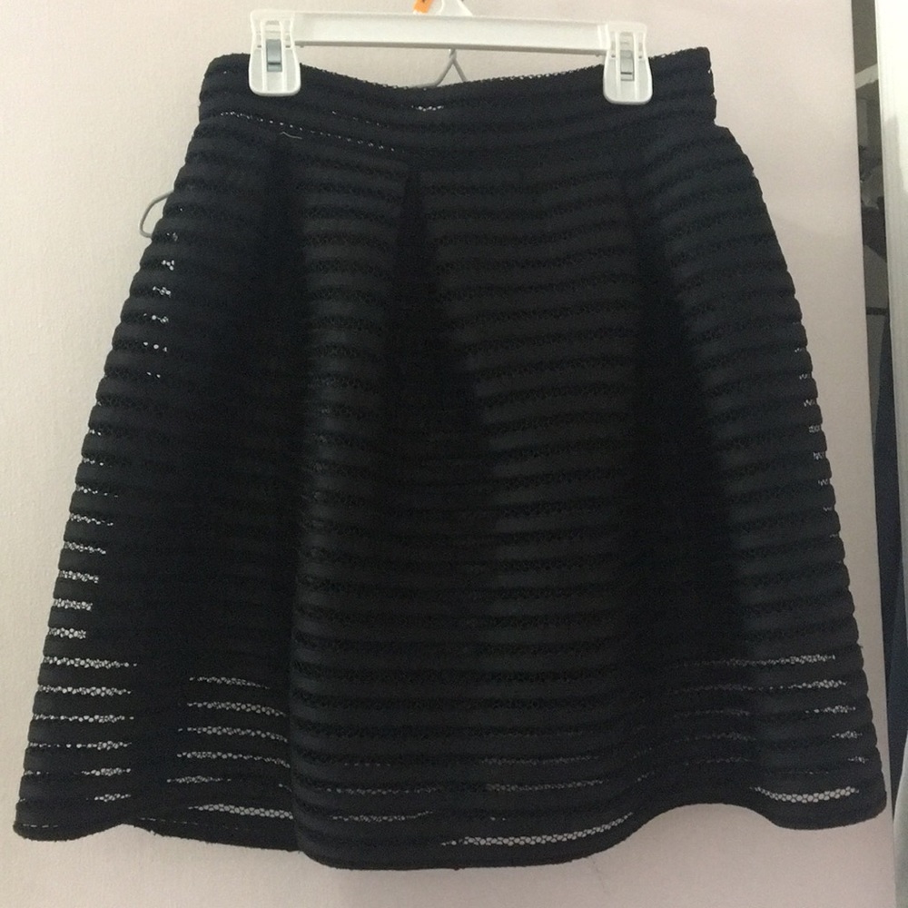 Black ruffle mini skirt